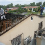 Damaged roof being repaired