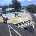 New plywood and felt underlayment being installed