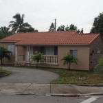 After photo of home with barrel tile roof