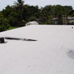 After photo of flat roof with white cap-sheet