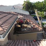 Corner of roof near the foyer being repaired