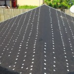 Roofing paper installed with tin cap