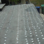 Tin-cap and roofing paper installation