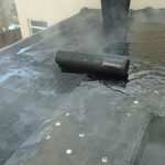 Fiber installation on flat roof area prior to Cap Sheet